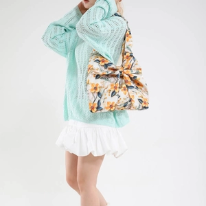 Floral shoulder tote bag with a large orange bow and blue flower print for women