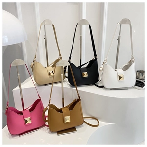 Five colored minimalist shoulder bags with signature golden square metal buckles on display