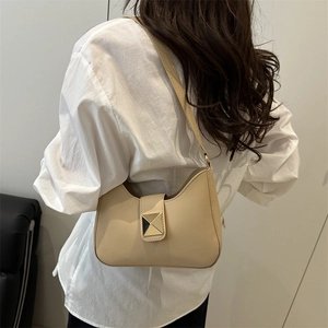 Minimalist beige crescent shoulder bag with a gold square buckle for modern women