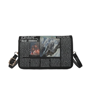 Minimalist black shoulder bag with newspaper print and mountain illustration