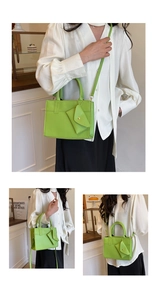 Close-up of lime green crossbody bag with a matching coin purse and embossed logo