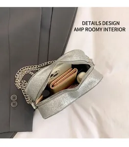 Interior view of silver sequin camera bag showing spacious storage for essentials