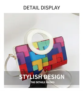 Detailed top view of geometric colorful block crossbody bag with white circular handle