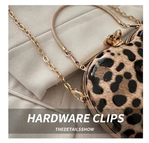 Detailed close-up of golden metal chain and glossy leopard print material on the evening bag