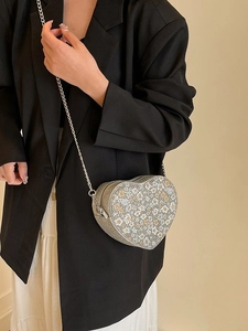 Chic heart-shaped sequin crossbody bag with floral pattern and metal chain strap