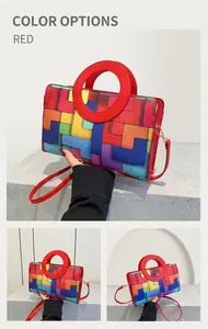 Detail of red hollow circular handle and colorful geometric pattern on the PU bag