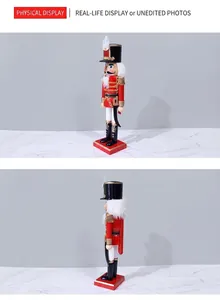 Detail of wooden nutcracker soldier with red feather accent and golden tassels