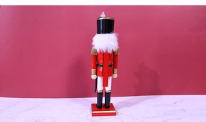 Macro view of mechanical wooden lever and structure on red Christmas nutcracker soldier