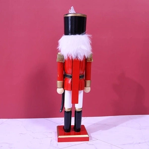 Back view of 36cm red wooden nutcracker soldier with white feathers on a red background