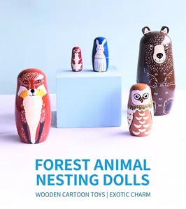 Detail of five-piece nesting dolls set featuring painted forest animals like bears and foxes