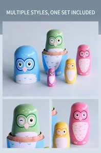 Macro view of five-piece set nesting owl dolls showing hand-painted wood textures