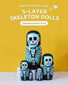 Set of five skull-themed nesting dolls with painted bones on black wood surfaces