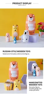 Detail of five-piece nesting bear and animal wooden matryoshka dolls on yellow background