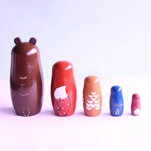 5-piece forest animal nesting dolls set featuring bear and fox hand-painted wood designs