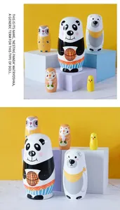 Detail showing five nested animal-themed wooden dolls with panda and polar bear designs