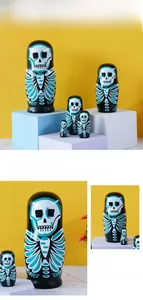 Detailed view of hand-painted wooden Matryoshka nesting dolls with skull pattern design