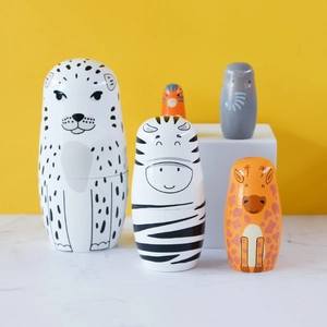 Handcrafted set of 5 animal-themed wooden matryoshka nesting dolls on a bright background