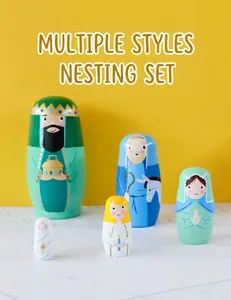 Detail of five-piece nesting dolls set with hand-painted Nativity scene on yellow background