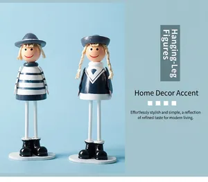 Detail of handcrafted wooden navy puppets with hanging legs in Mediterranean style
