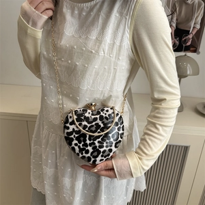 Fashionable heart-shaped crossbody bag with leopard print and gold chain strap