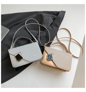 Detail view of sparkly sequin crossbody bags in silver and gold with geometric buckles