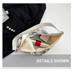 Interior detail of floral tote bag showing large capacity for cosmetics and daily items