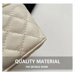Detailed close-up of cream beige quilted leather texture and diamond stitching pattern