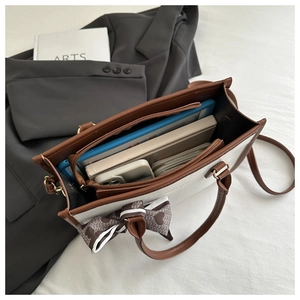 Internal view of a retro tote bag showing large capacity for daily items and tablet