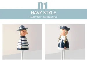 Detail of handcrafted nautical wooden sailor figurines with striped shirts and hats