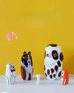 Detail of five-layer dog themed hand-painted wooden nesting dolls for kids