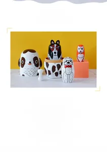Detail of hand-painted dog themed wooden nesting dolls with clear wood texture