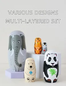 Set of five nested hand-painted wooden animal dolls featuring elephant and panda