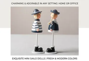 Close-up of wooden nautical hanging leg dolls with blue and white stripes craftsmanship