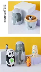 Detail of five-piece hand-painted wooden animal nesting dolls with smooth lacquer finish
