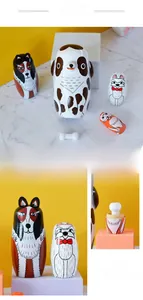 Macro detail of hand-painted wooden Russian nesting dolls featuring cute dog patterns