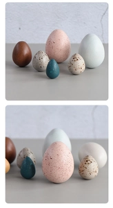 Artistic multi-colored egg-shaped wooden ornaments in various sizes for home decoration