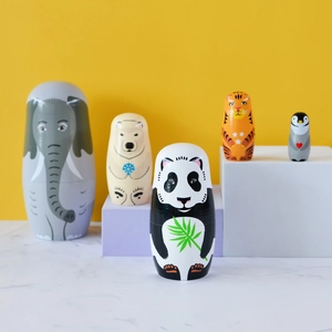 Set of 5 wooden animal nesting dolls including elephant, bear, panda, tiger, and penguin