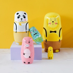 5-piece set of wooden animal nesting dolls featuring panda, lion, and pig for nursery decor