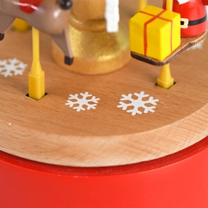 Carrousel boîte à musique de Noël en bois avec renne peint et base à flocons