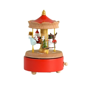 Boîte à musique carrousel en bois avec figurines de Noël sur socle rouge et toit en bois