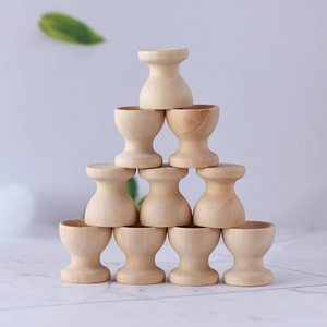 Stack of ten minimalist natural wood egg cups for DIY painting and home desk decor