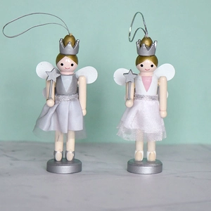 Set of two wooden nutcracker angel ornaments with star wands for Christmas tree