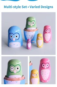 Detail of five colorful wooden owl nesting dolls with hand-painted patterns