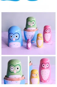 Detail of five colorful wooden owl nesting dolls with hand-painted patterns