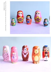 Detail of hand-painted wooden Matryoshka dolls with blue owl and floral patterns