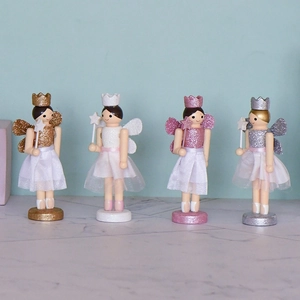Set of four colorful wooden fairy nutcracker figurines for festive Christmas tree decor