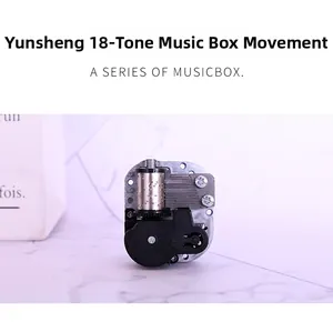 Detailed macro view of an 18-note mechanical music box movement with central axis