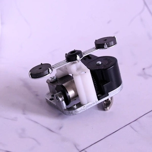 Macro view of mechanical music box movement with metal gears and magnetic rotating arms
