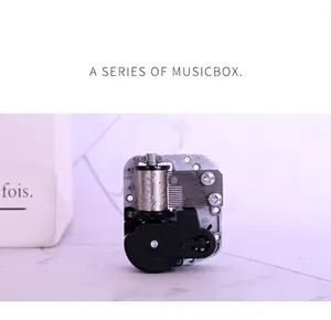 Close-up of 18-note mechanical music box movement with steel comb and gears