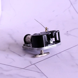 Precision wind-up music box movement with t-bar handle and 18-note mechanical structure